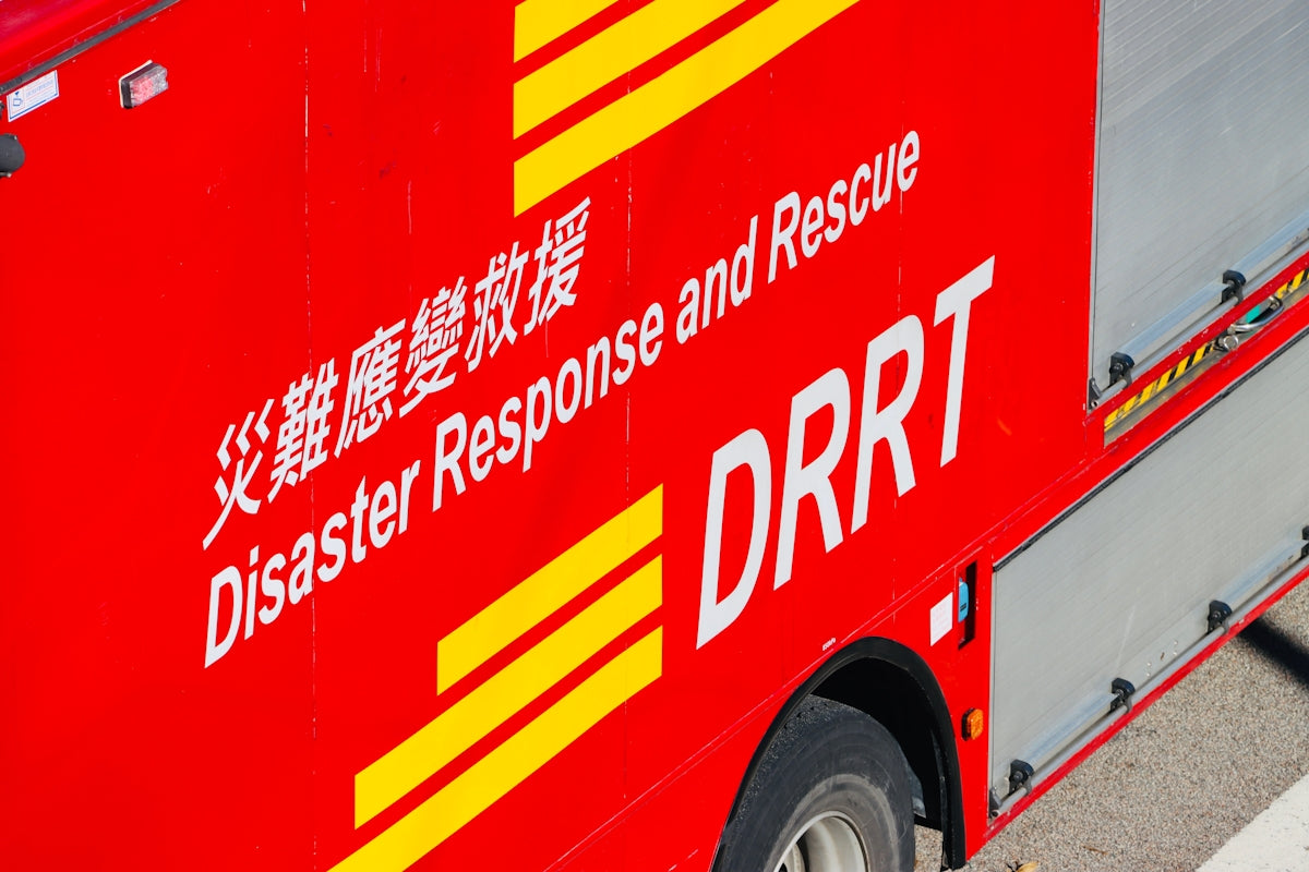 Red vehicle with text disaster response and rescue drrt